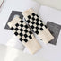 Cream and black checkered gloves; breathable yet warm acrylic knit suited for outdoor walks and hiking.