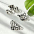 Angled view of  3 checkered hair claws in various shopes , ideal for quick updos and ponytails.