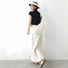 Back view of the off-white crescent bag styled with a minimalist summer outfit.
