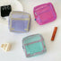 Chroma mesh pouches in pink, mint and lilac on vanity; breathable zip organizers for makeup and small essentials.