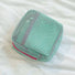 Mint Chroma mesh pouch with pink zipper; airy mesh zip bag for toiletries and quick-dry travel packing.