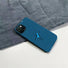 Detailed view of concentric circles and dancing figure on blue silicone case. Creative geometric phone cover.