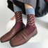 Model wearing a pair of brown cotton socks, ideal for everyday outfits and sneakers.