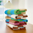 Five Color Game Plaid Face Towel in various colors are stacked together.