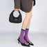 Model wearing a pair of pink houndstooth sock, easy for travel days and daily comfort.
