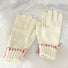 White colored-thread hemming gloves with contrast stitching; clean winter look for daily wear.