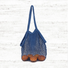 Folded view of Colorful Net Shopper Bag in blue, easy for commuting and weekends.