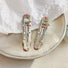 Angled view of Colorful Polka Dot Hair Clip in wave shape, ideal for quick updos and ponytails.