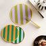 Top view of Colorful striped PU leather coasters/hot pads in various sizes and patterns .
