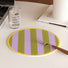 Flat lay of Colorful Striped Coaster/Hot Pad product in purple and green , great for home decor.