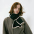 Model wearing a wool knit scarf in black, easy for weekend styling and gifting.
