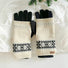 Convertible Fair Isle knit glove cuffs in navy with tan/cream pattern, paired with grey gloves; winter-ready.