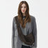 Model wearing the dark brown corduroy crescent bag as a crossbody.