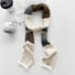 Front view of Cozy Patch Skinny Scarf in gray, ideal for everyday styling and weekend outings.