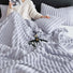 Purple wave textured fleece blanket showing soft polar fabric and unique pattern.