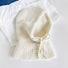 An ivory cream-colored winter balaclava hat, featuring a soft wool-like texture and adjustable fit.