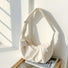 Creamy white padded bag with a clean, curved design, suitable for fresh aesthetic styling.