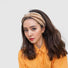 Model wearing a khaki Crochect Bow Headband, easy for workdays and special occasions.
