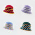 Four color variations of the cross striped bucket hat displayed together.