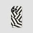 White silicone iPhone case with bold black diagonal stripes. Modern 3D geometric pattern for a sleek look.