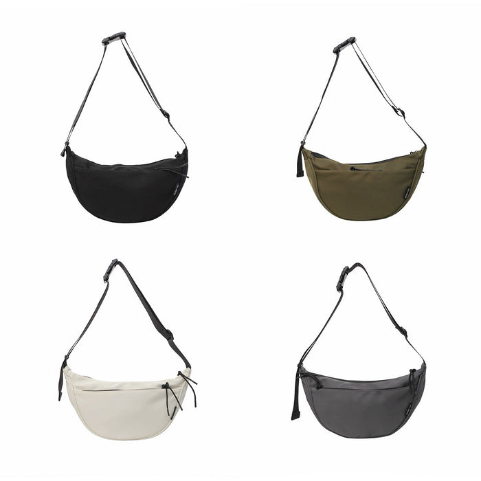 Four nylon crescent crossbody bags in black, olive, cream, and charcoal with adjustable straps and zip-top fastening.