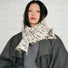 Model wearing a wool scarf Dual-Sided Aurora Texture Soft Scarf, easy for weekend styling and gifting.