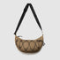 Front view of an earth brown water-resistant nylon crescent sling bag with black elastic cord detailing.