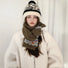 Model wearing cozy Fair Isle pattern wool-acrylic scarf in olive green with blue and red accents.