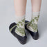 Angled view of Floral Embroidered Socksin celadon, great for daily wear and lounging.