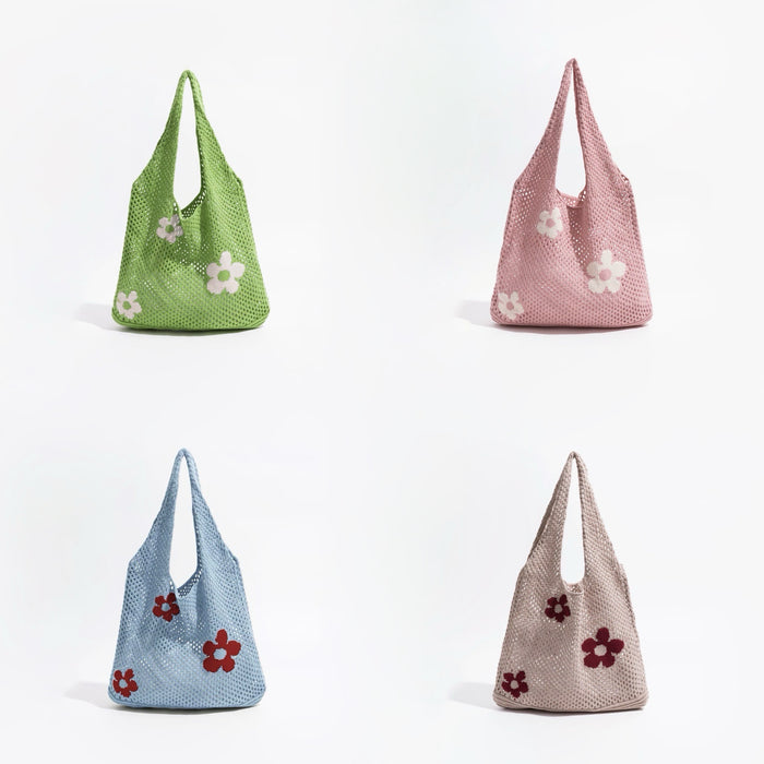 Four crochet shoulder bags in green, pink, blue, and beige, each with white or red flower appliques.