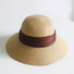 Front view of brown Ribbon Straw Hat. Rich chocolate tone with a refined weave and matching ribbon accent.