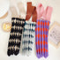 Three argyle knitted bags rolled up to show compact storage and stretchable material.