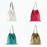 Four foldable canvas pleated shopper bags in white, red, teal, and khaki with dark straps.