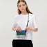 Model showcasing the compact size of the striped Oxford bag, ideal for lightweight travel.