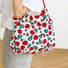 Model carrying a rose Tote Bag, easy for commuting and weekends.