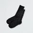 Close-up of Fuzzy Check Textured Socks in black, great for daily wear and lounging.