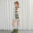 Model wearing fuzzy nature-inspired wool-polyester scarf with brown, orange, green, and cream stripes in beige.