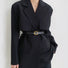 Side profile of model styling black Gold C Buckle Belt.