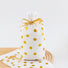 Front view of White PE gift bag with gold polka dots and a gold satin ribbon drawstring closure.