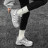 Model wearing Googly Eyes Socks in white, great for daily wear and lounging.