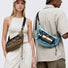 Two models wearing earth brown and light blue nylon sling bags, demonstrating a modern Gorpcore urban aesthetic.