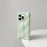 Mint green 3D wavy silicone case with a soft gummy feel, perfect for a fresh aesthetic.