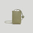 Flat lay of Hanging Ball Leather Bag in khaki green, great for everyday carry and travel.