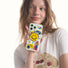 Held by person, Acrylic Happy Stickers case with a yellow smiley magnetic holder. Fun portable accessory.