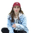 Model wearing a red cotton baseball cap with white heart embroidery.
