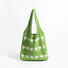 Green blended knitting yarn crochet bag with white heart pattern.