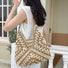 Model carrying a khaki Holiday Style Straw Tote Bag on the shoulder, easy for commuting and weekends.