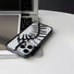 Close-up of Hollow Fishbone Phone Case in polish black, showcasing the detailed artistic hollow craftsmanship.