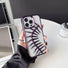 Model holding Hollow Fishbone Phone Case in polish purple. Unique trendy skeletal phone cover for Gen-Z.