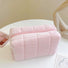 Angled view of Icecream Makeup Bag in pink, ideal for travel makeup and toiletries.